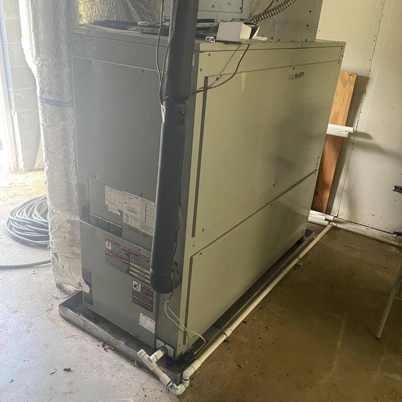 Packaged HVAC unit with failed compressor in utility room