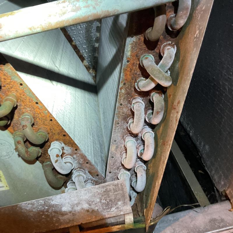 Evaporator coil with frost and rust buildup Evaporator coil with frost and rust buildup