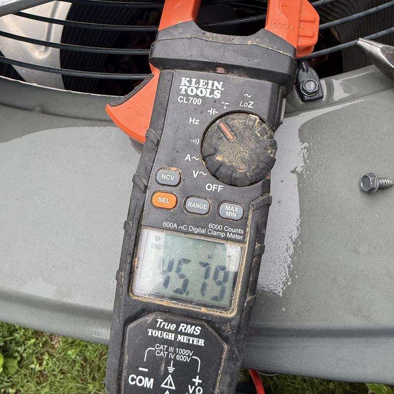 Clamp meter measuring air conditioning unit current Clamp meter measuring air conditioning unit current