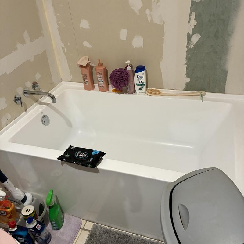 Tub surround installation with new valve and spout