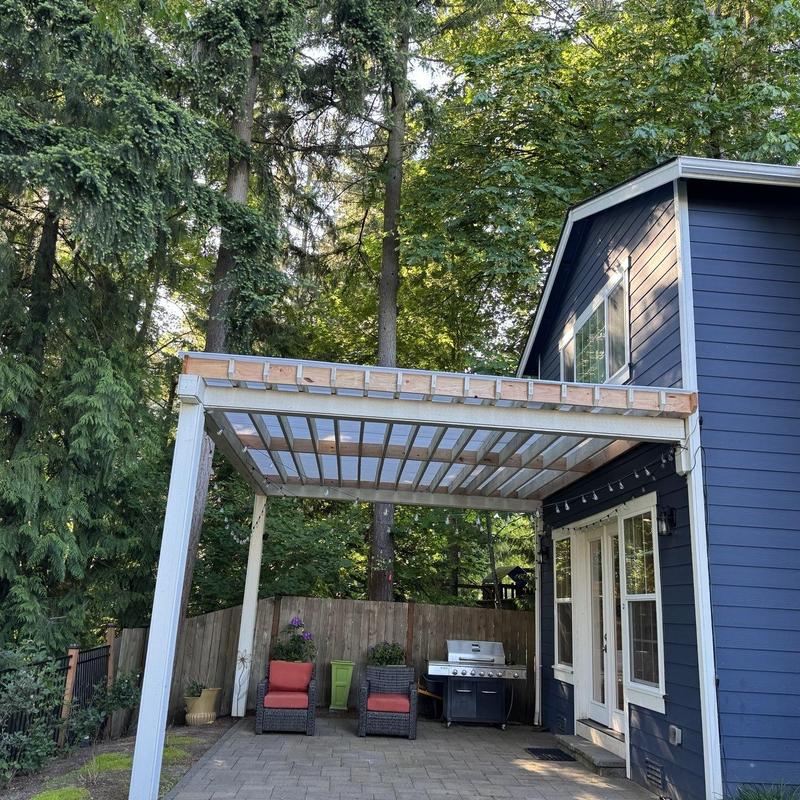 Patio roof with pergola frame and translucent panels
