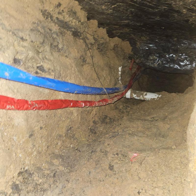 Hot and cold water supply lines in crawlspace