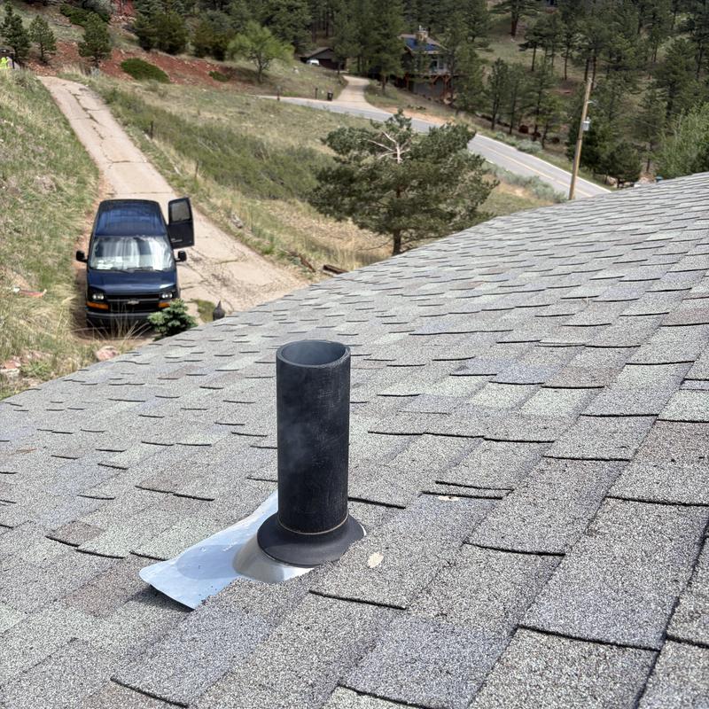 Plumbing vent pipe on shingled roof in Boulder, CO Plumbing vent pipe on shingled roof in Boulder, CO