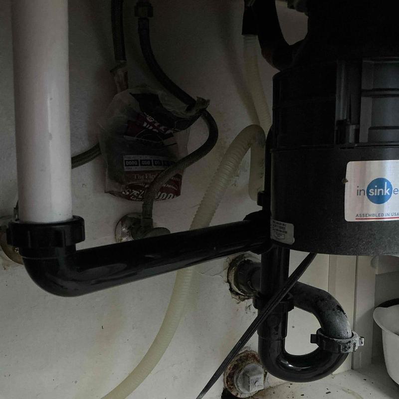 Tubular drain piping and garbage disposal installation