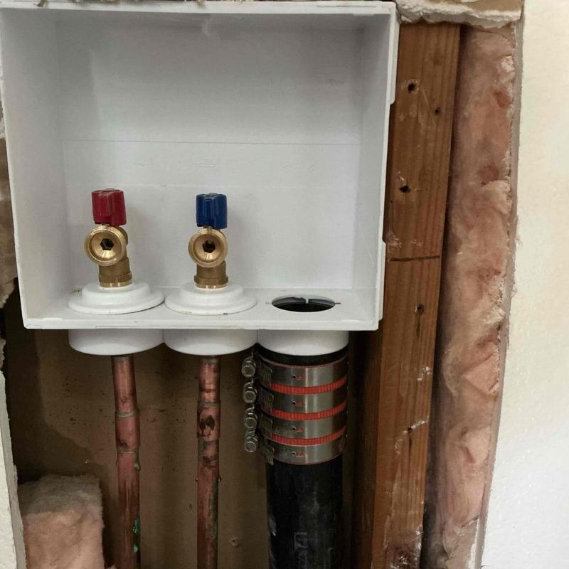 Laundry valve box with red and blue valves installed