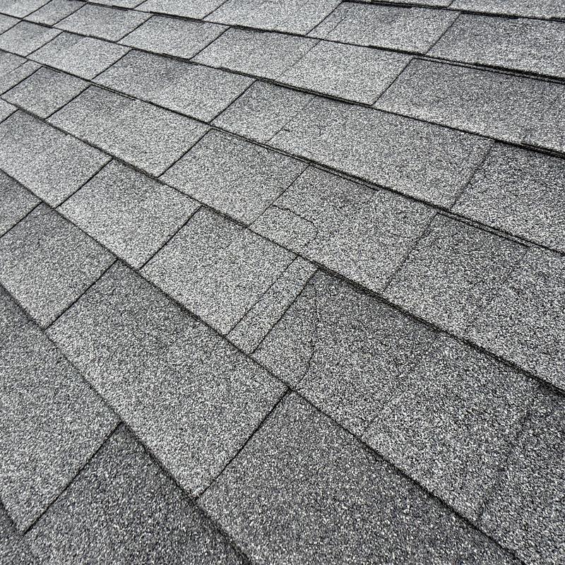 Asphalt roof shingles showing cracks on Capitol Beach roof