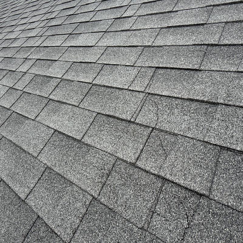 Asphalt shingle roof with visible cracks at Capitol Beach