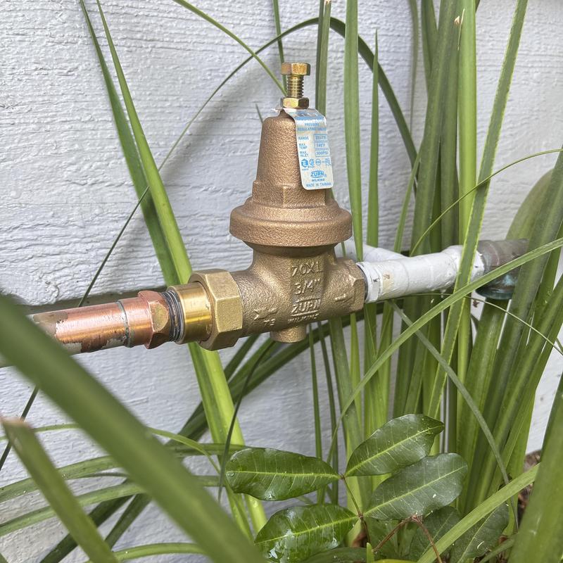 Pressure regulator valve with hose bib installation outdoors Pressure regulator valve with hose bib installation outdoors