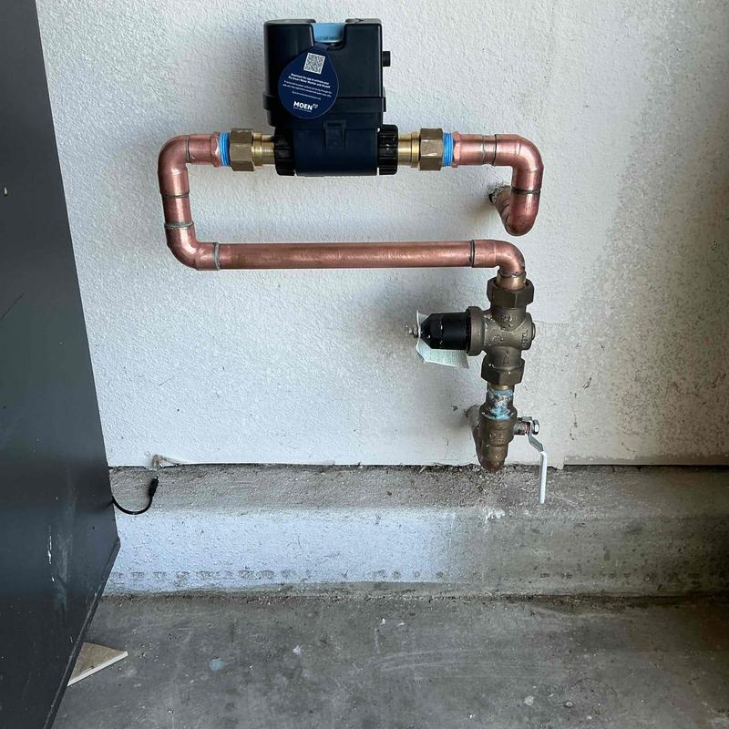 Moen Flo water monitoring device on copper piping