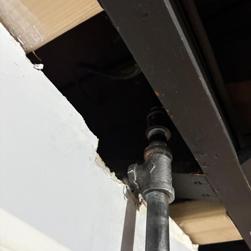 Gas piping and shutoff valve under ceiling joists