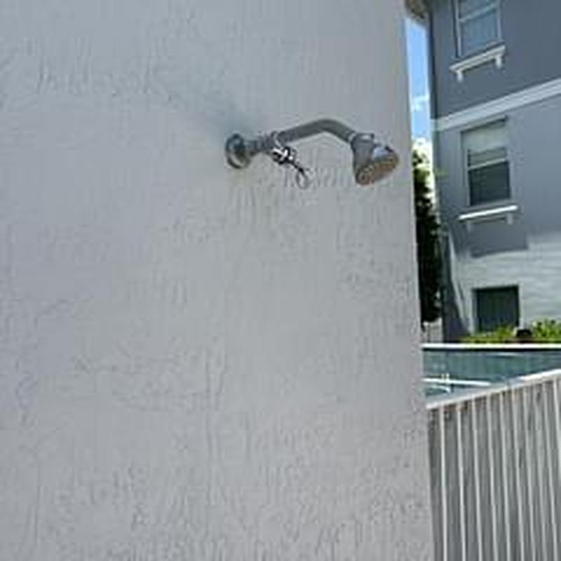 Pool shower valve with pull chain on exterior wall
