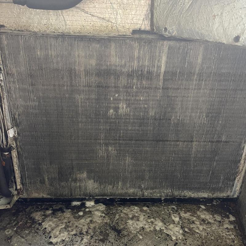 Evaporator coil with heavy dirt buildup and debris