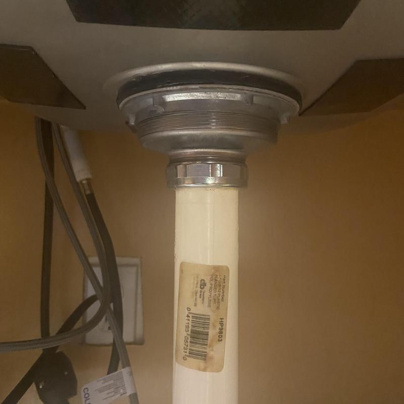 Basket strainer and PVC drain pipe under kitchen sink