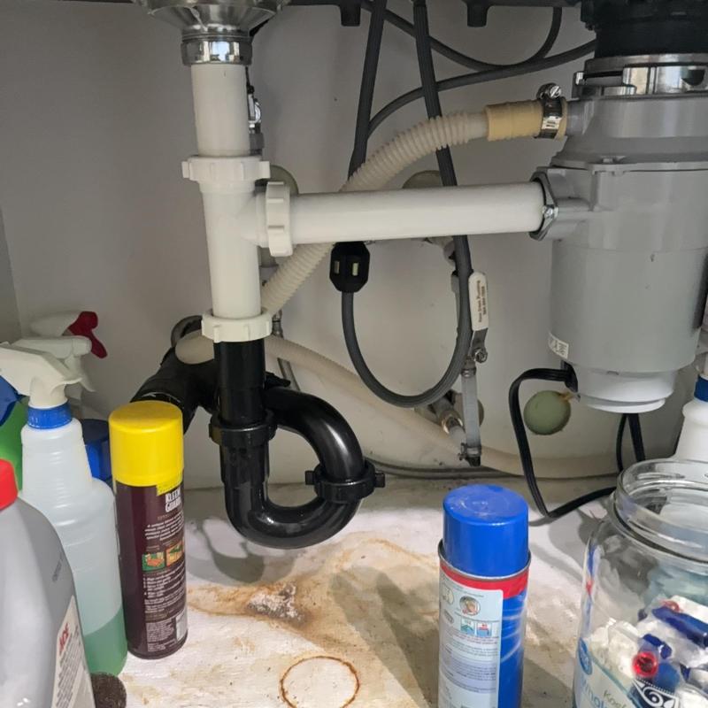 Kitchen sink drain pipes and garbage disposal installation