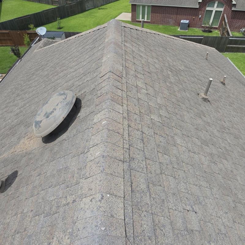 Asphalt shingle roof with vent and pipe penetrations