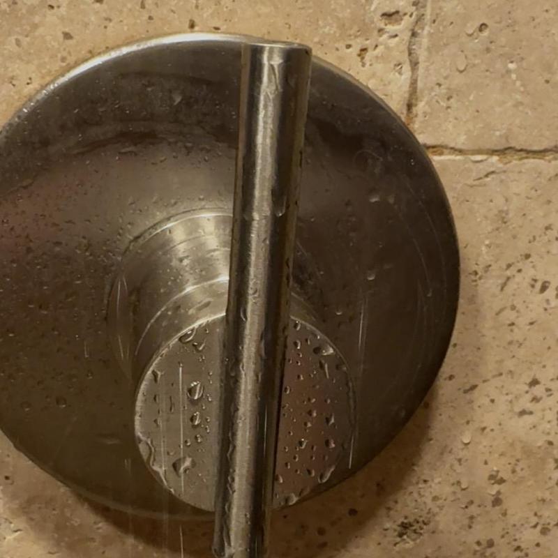 Glacier Bay shower handle with water droplets