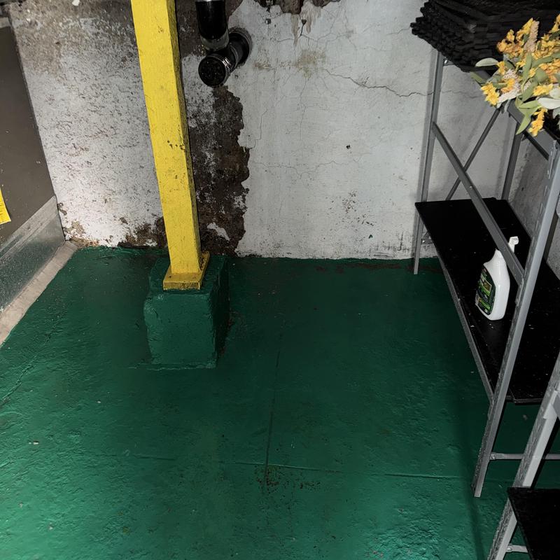 Main drain line with basement pipe and wall damage