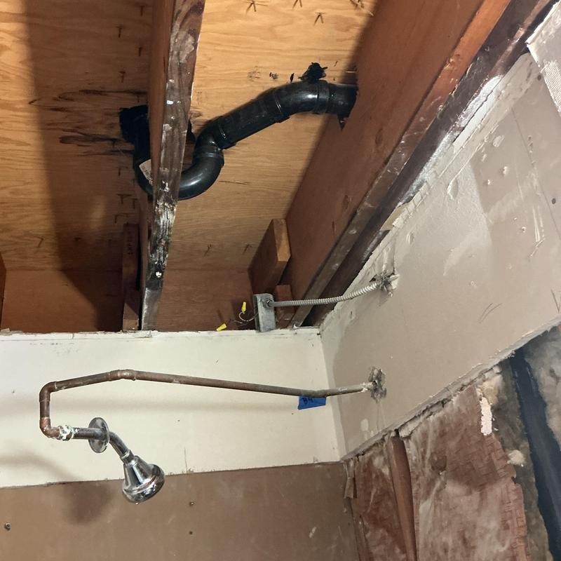 Shower drain replacement with exposed ceiling piping