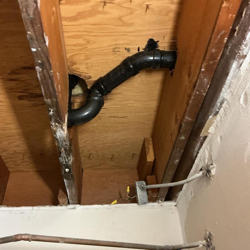 Shower drain replacement with PVC piping in ceiling cavity