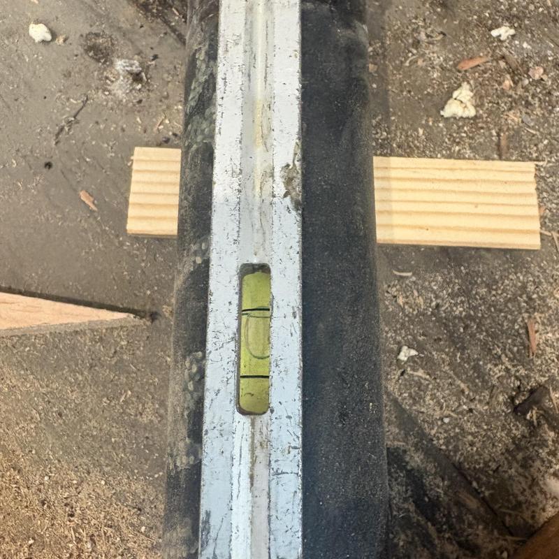 Shower pan level check during installation in floor cavity