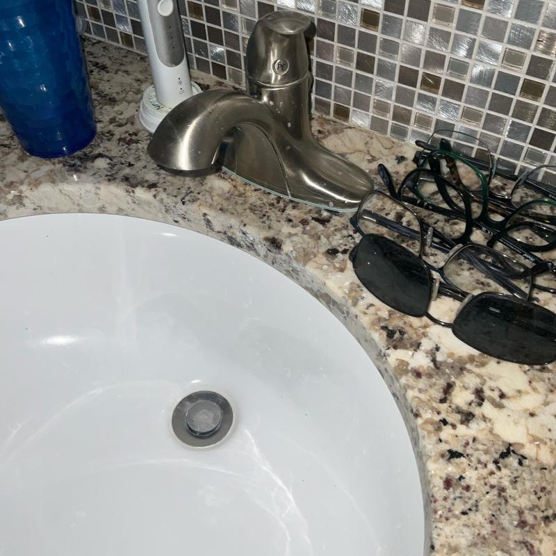 Kitchen sink faucet and granite countertop with glasses