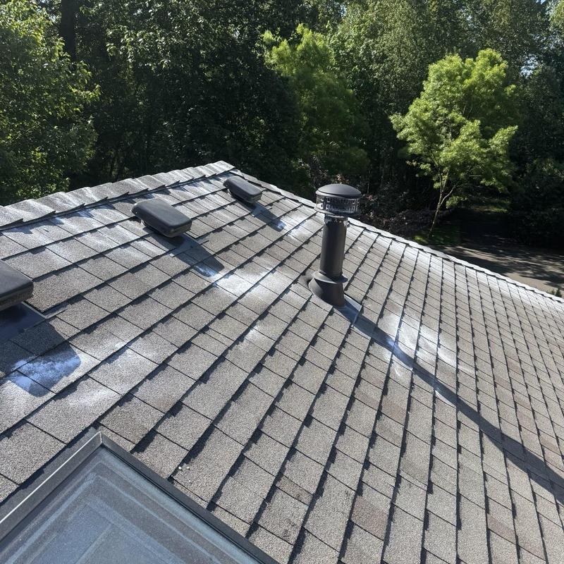 Asphalt shingle roof with vents and pipe flashing