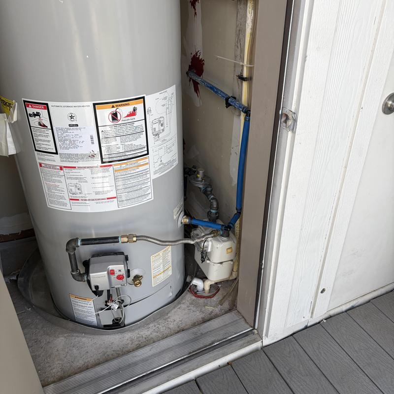 Water heater with gas regulator and piping system Water heater with gas regulator and piping system