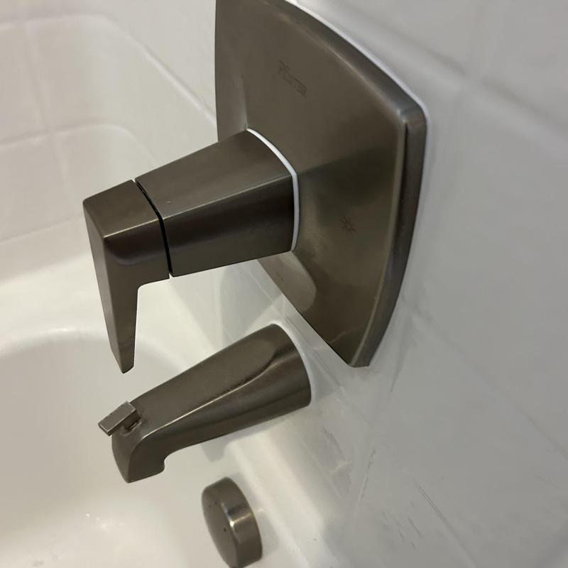 Shower valve and handle with waterproofed trim installation