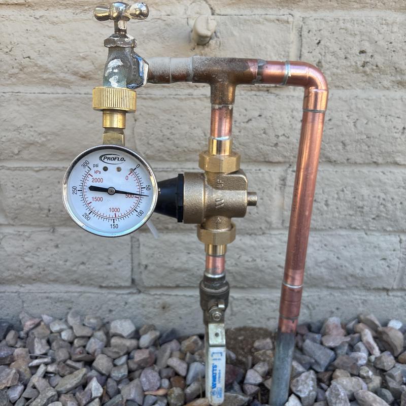 Pressure regulator valve with pressure gauge and piping