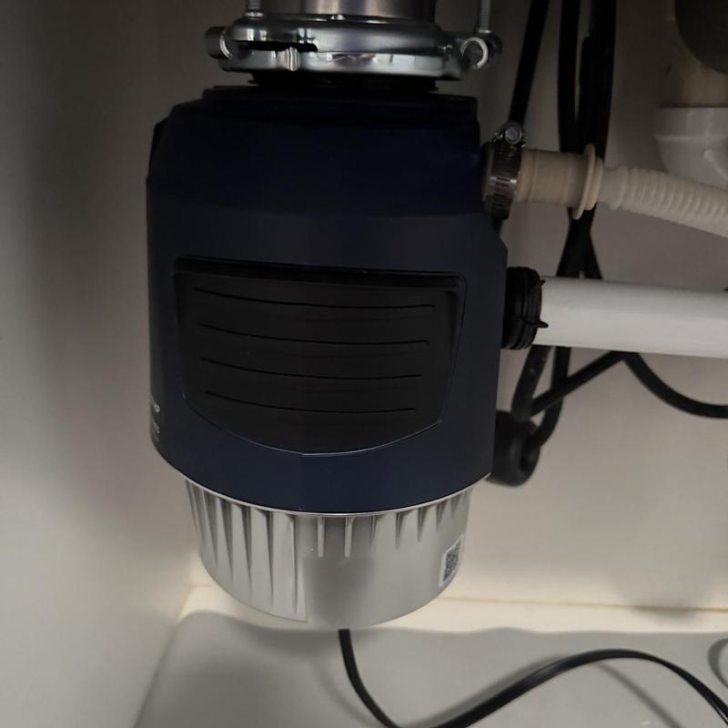 Garbage disposal installed under kitchen sink
