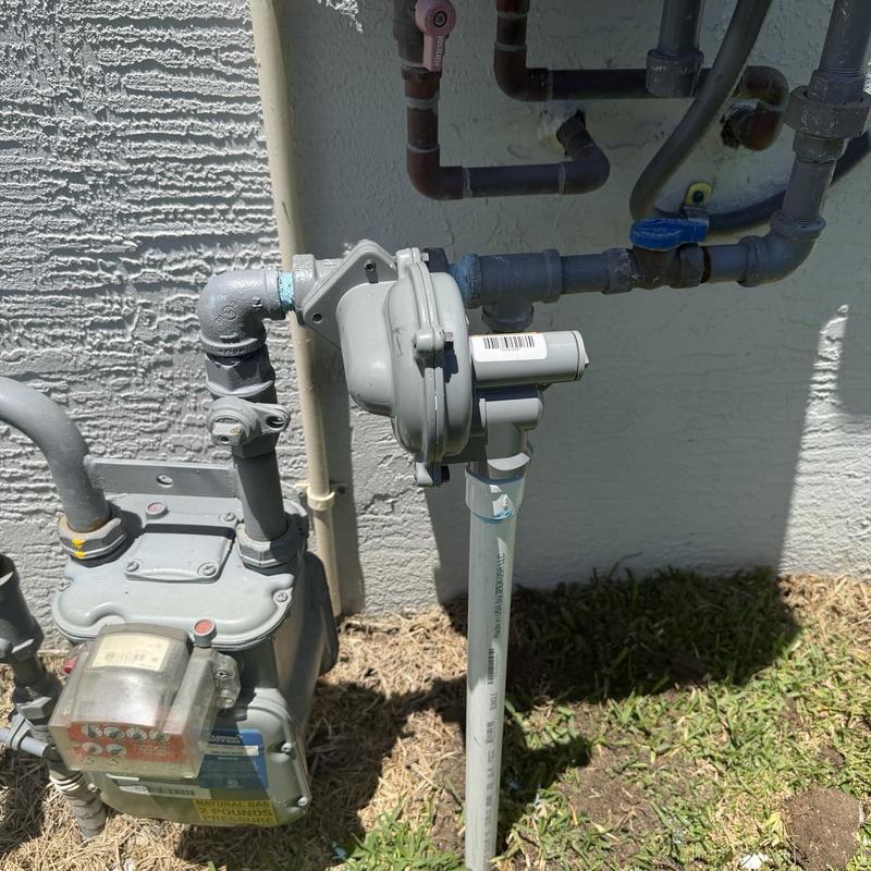 Gas regulator installation on outdoor meter system