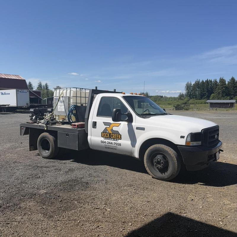 Drain cleaning truck with snake and air ram equipment