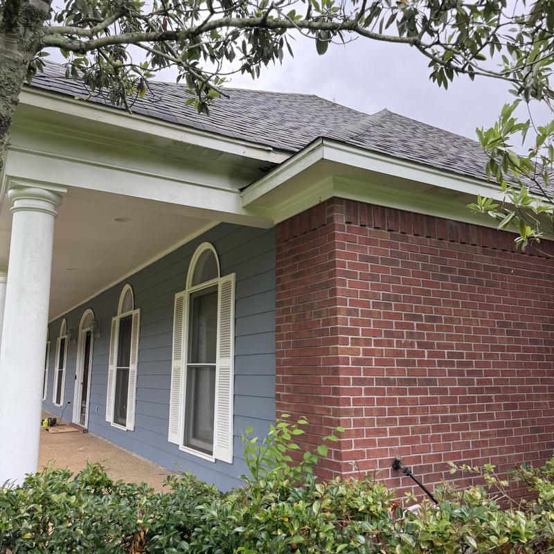 Gutters and dormers with new siding installation