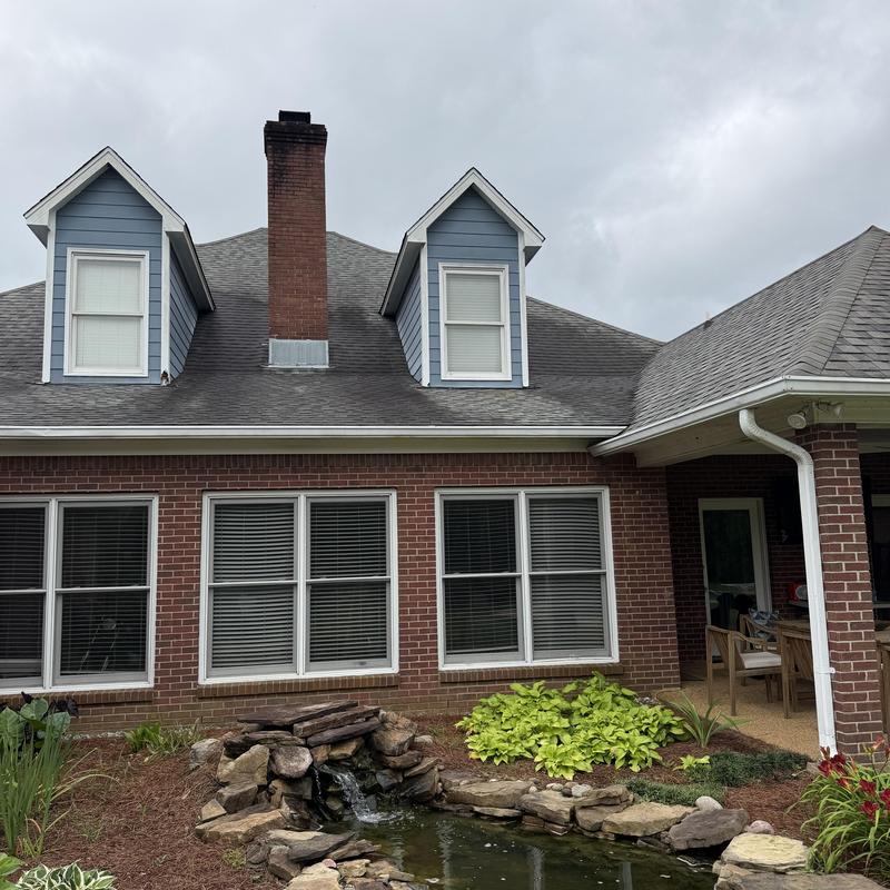 Dormer siding and gutter removal on brick home