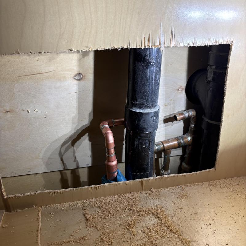 2 inch drain line and copper plumbing inside wall cutout