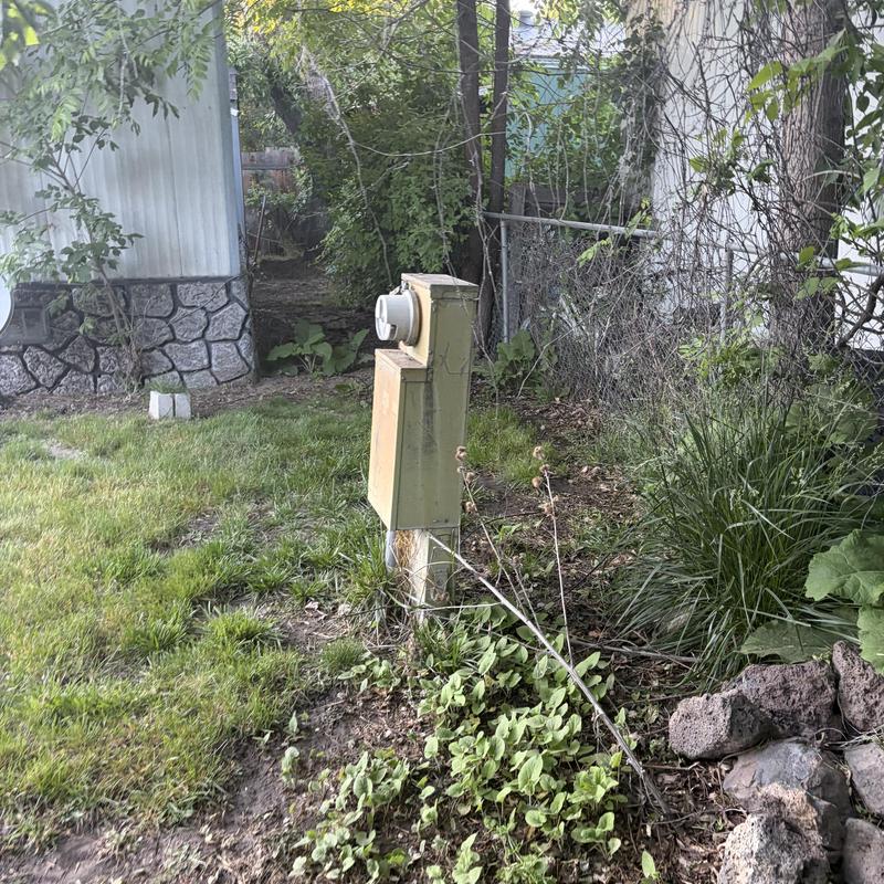 Electrical meter box on residential property outdoors Electrical meter box on residential property outdoors