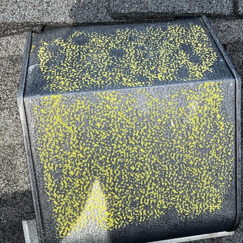 Roof vent with yellow chalk hail damage markings