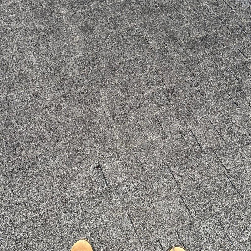 Asphalt shingle roof with visible hail damage