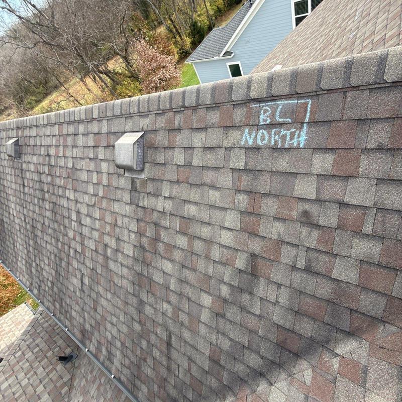 Asphalt shingle roof with ridge vents and chalk markings