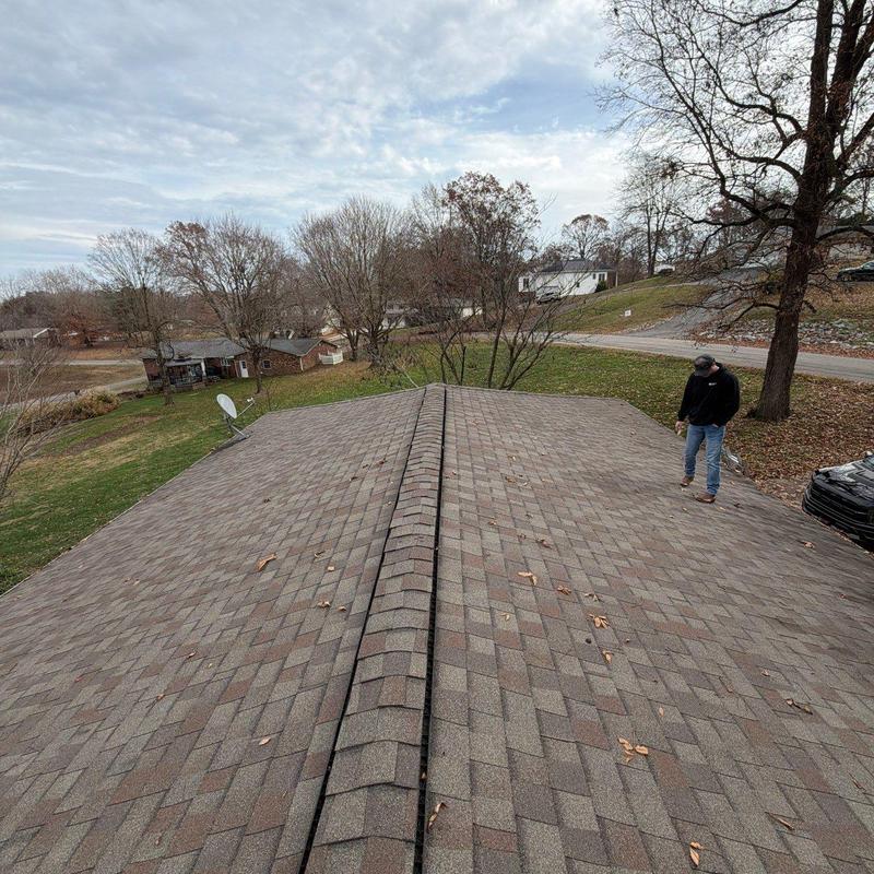 Asphalt shingle roof with ridge cap inspection