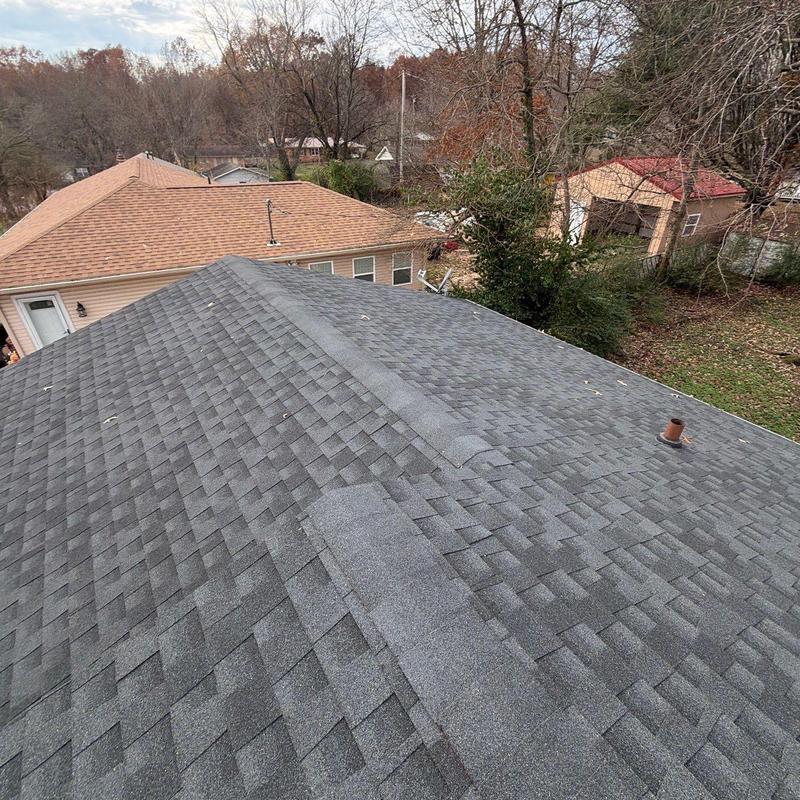 Asphalt shingle roof with ridge vent inspection