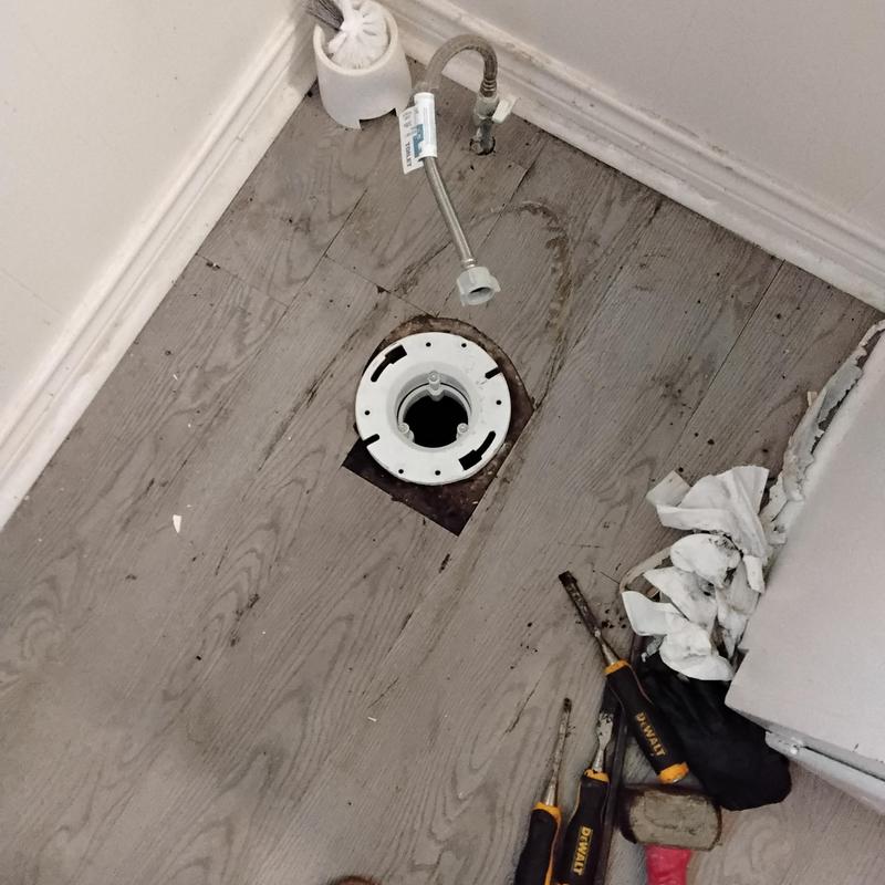 PVC inner toilet flange installation on wooden floor