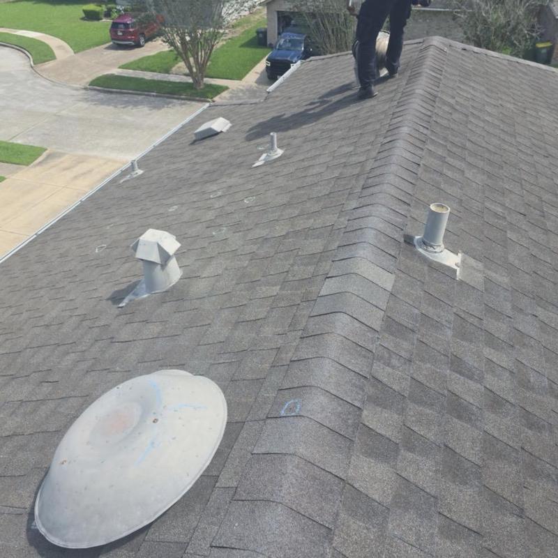 Architectural shingle roof with hail damage marks