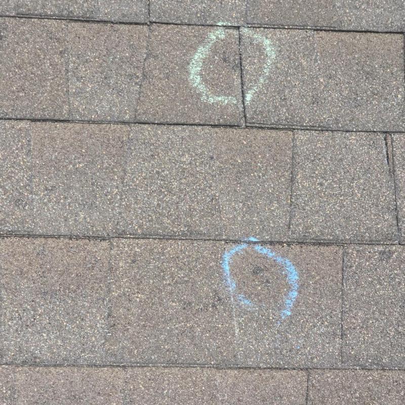 Architectural shingles hail damage marked for inspection