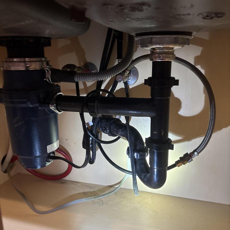 Kitchen sink drain pipes and garbage disposal installation