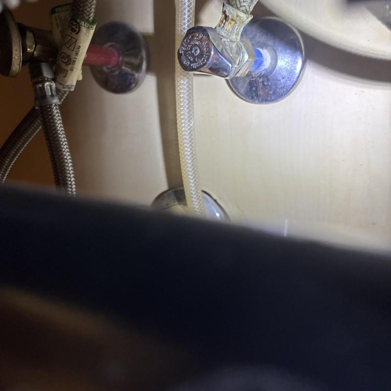 Kitchen faucet supply lines and shutoff valves under sink
