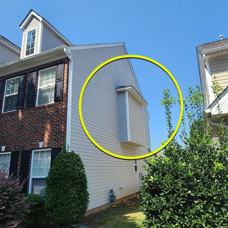 Vinyl siding with boxed window bump-out on house exterior