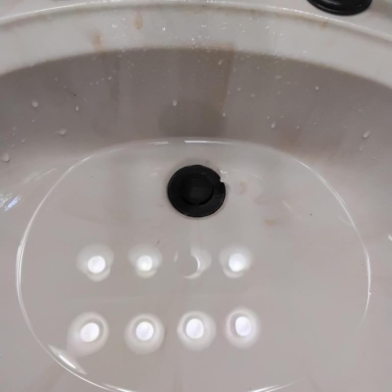 Lavatory sink drain with new pop-up stopper installed