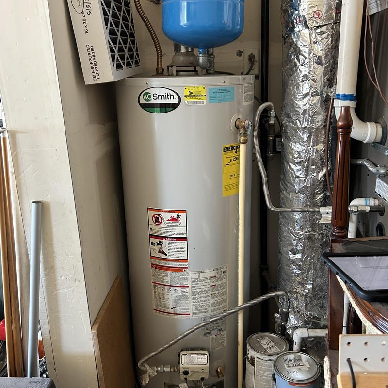 Water heater with pressure tank and piping connections
