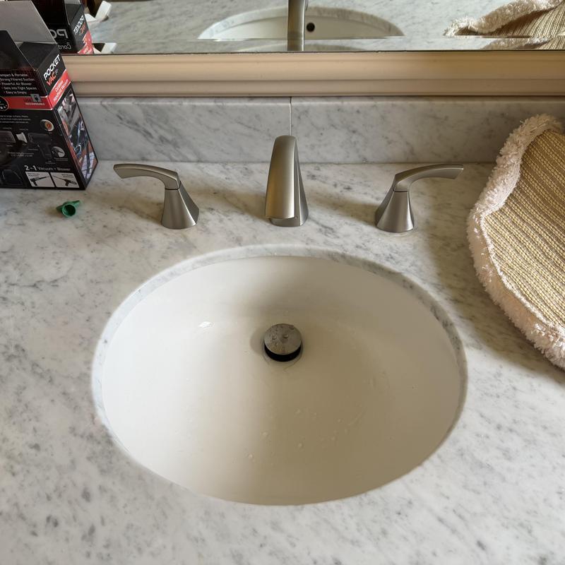 MOEN widespread faucet with pop-up drain on marble sink